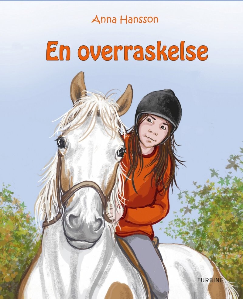 En Overraskelse - Rideskolen 6 - Anna Hansson - Bog - Turbine